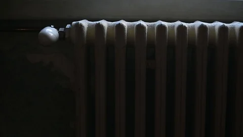 Hand adjust the heating of a radiator by controlling the thermostat Video stock 101306401