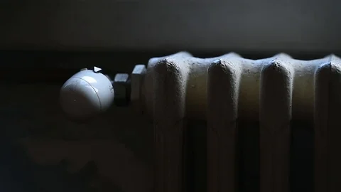 Hand adjust the heating of a radiator by controlling the thermostat Video stock 101306488