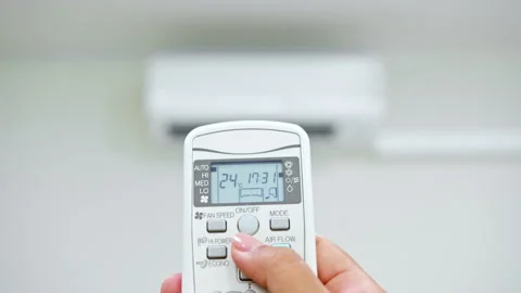 Hand adjust temperature of air conditioner at 25 degree C Stock Footage 196910761