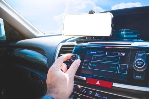 Hand adjust to volume button and white blank display Stock Photos