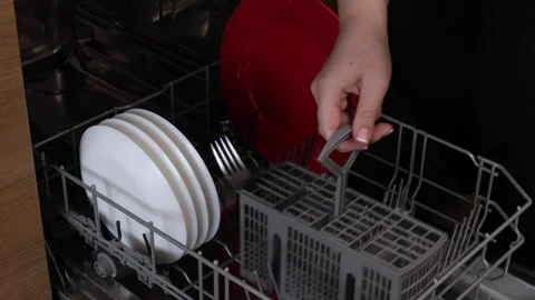 Hand adjusting and moving a gray plastic cutlery container within the lower.. Stock Footage 320738271