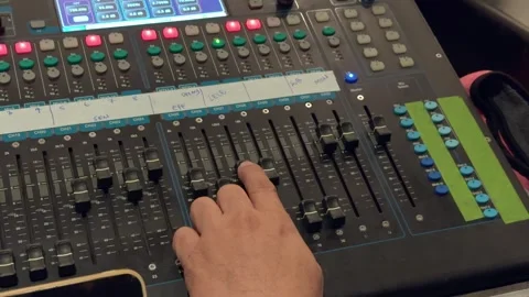 Hand Adjusting Audio Mixer Channel Faders in Close Up from Above Stockbeeldmateriaal 346012310