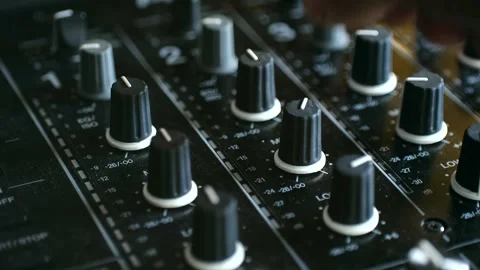 Hand adjusting audio mixer knobs, show intricate details sound control dynamic 库存影片 317905576