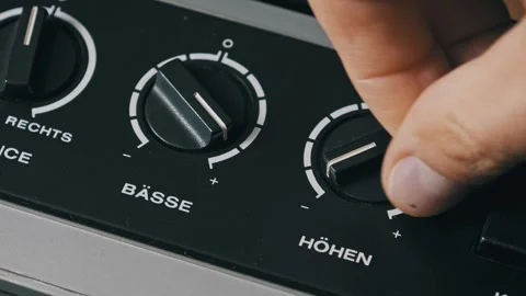 Hand Adjusting Bass Treble Knobs on German Audio Gear Video stock 320354774