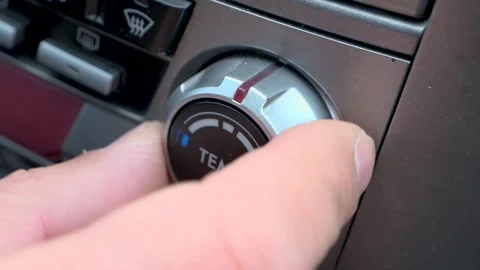 A hand adjusting Car Temperature Control Knob Vidéo 262895695
