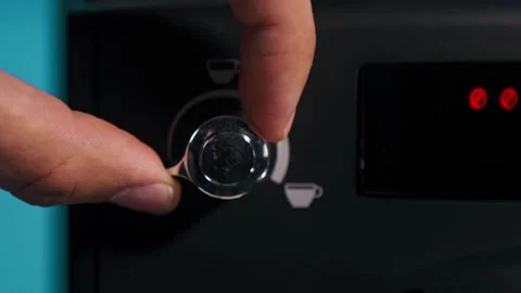 Hand adjusting coffee dose on automatic coffee machine Stock Footage 160160140