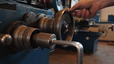 Hand adjusting industrial machine wheel - close up Video stock 152769999