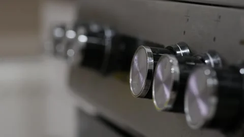 A hand adjusting knobs on a metallic panel. Close up Video stock 274195613