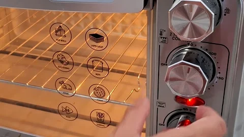 Hand Adjusting Oven Dial for Baking Close up Interior View Stock Footage 342783559