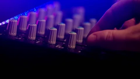 Hand adjusting portable cassette tape studio mixer knobs Stock Footage 161746948