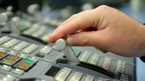 Hand adjusting on switcher buttons in studio TV station,Television Broadcast. Stock Footage 149308103