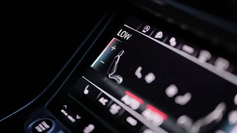 A hand adjusts the climate control system in a car. Male hand regulating the air Stock Footage 335939839