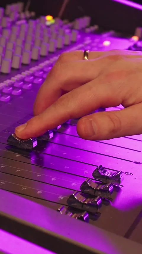 Hand Adjusts Fader On Professional Audio Mixing Console In Studio Stock Footage 330044488