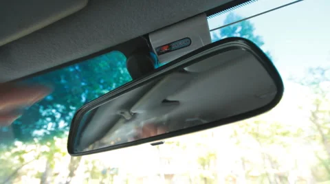 Hand adjusts the rearview mirror Stock Footage 6531965