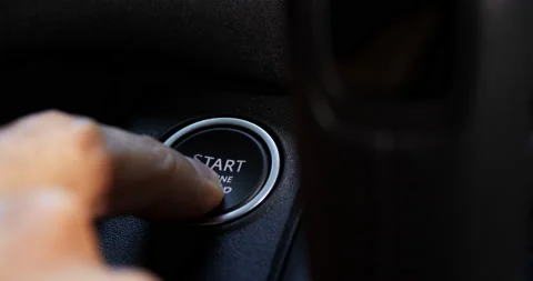 Hand of an adult presses the engine start button Video stock 201218359