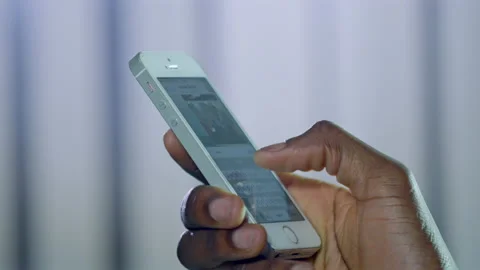 Hand of African American man typing message on mobile phone Stock Footage 229844865