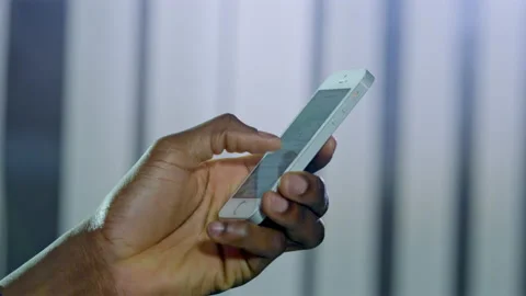 Hand of African American user sending message to friend Stock Footage 229845171