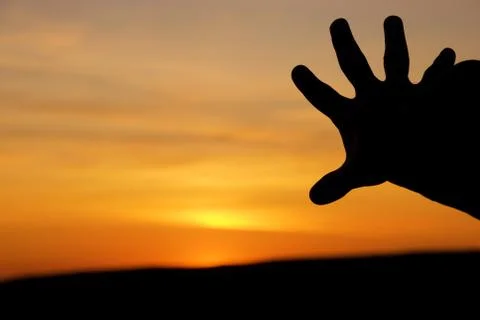 Hand against the sky Stock Photos
