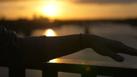 Hand against sunset Stock Footage 86499154