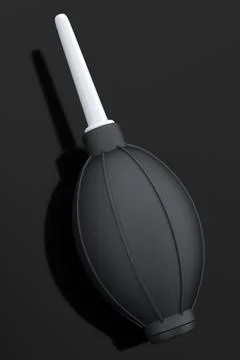 Hand air blower bulb for camera isolated on black background. Illustrazione stock