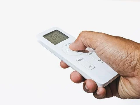 Hand with air conditioner remote control Stock Photos
