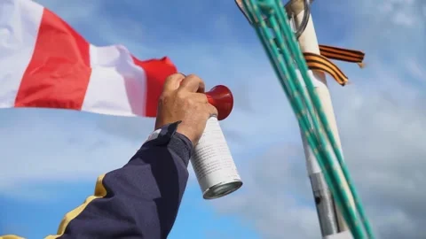 Hand air horn with sky background Stock Footage 304928039