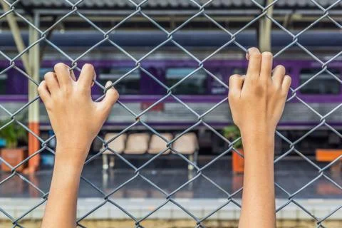 Hand and cage Stock Photos
