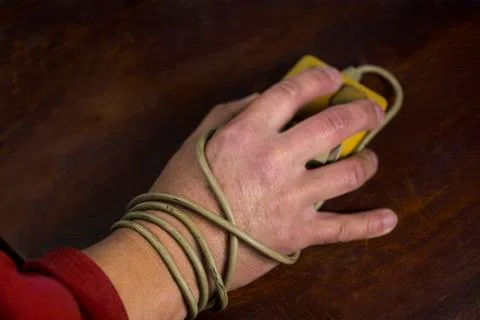 Hand and computer mouse cable 写真素材