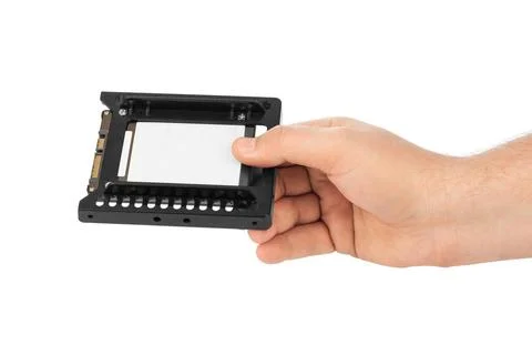Hand and computer SSD drive Hand and computer SSD drive isolated on white ... Stock Photos