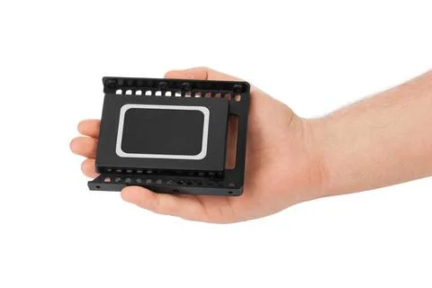 Hand and computer SSD drive Hand and computer SSD drive isolated on white ... Stock Photos
