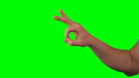 Hand and Finger flicking hard in front of green screen Stock Footage