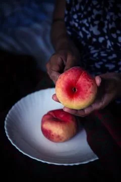 Hand and Flat Peach Stock Photos