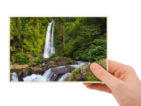 Hand and Gitgit Waterfall in Bali Indonesia (my photo) Stock-Fotos