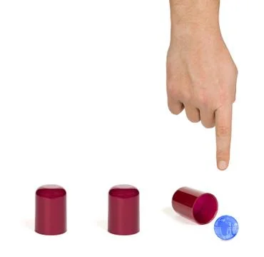 Hand and globe shell game Stock Photos