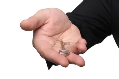 Hand and key Stock Photos