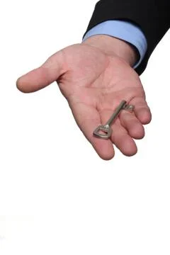 Hand and key Stock-Fotos