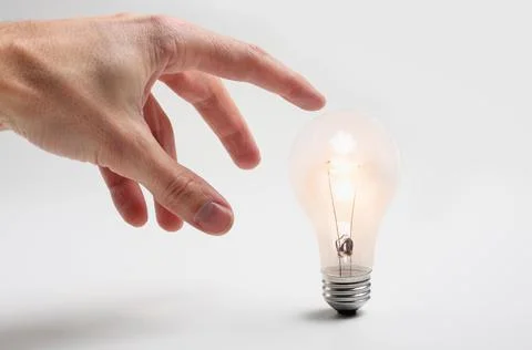 Hand and light bulb idea concept Stock Photos