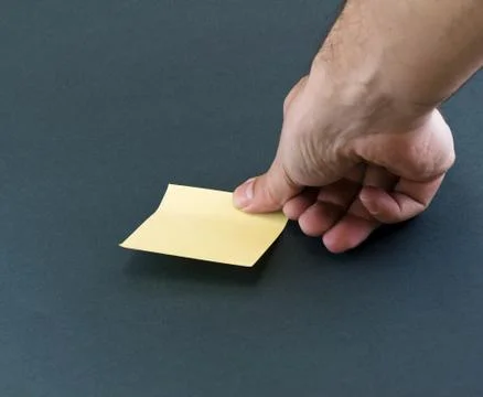 Hand and a post-it Stock Photos