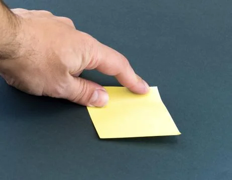Hand and a post-it Stock Photos