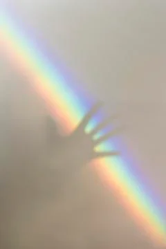 A hand and rainbow Stock Photos