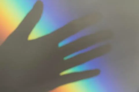 A hand and rainbow Stock Photos