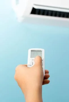 Hand and remote control 스톡 사진