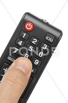 Hand and remote control Stock Photos