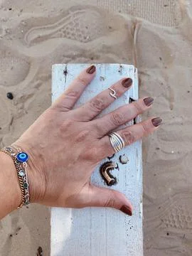 Hand and sand Stock Photos