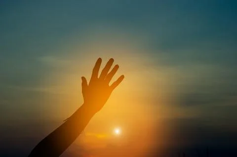 Hand and shadow in the corner. sunset And there is show of love.  silhouette  Stock Photos