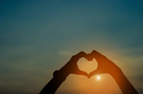 Hand and shadow in the corner. sunset And there is show of love.  silhouette  Stock-Fotos