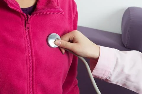 Hand and stethoscope Stock Photos