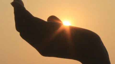 Hand and the sun Video stock 42856084