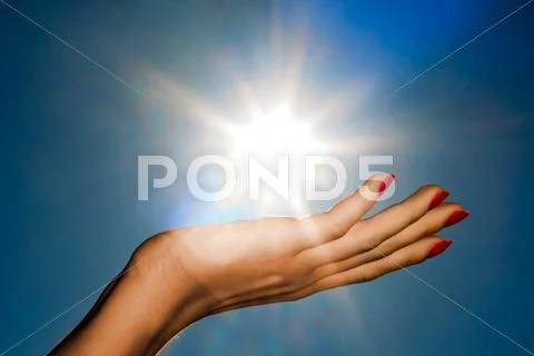 Hand and sun Stock Photos