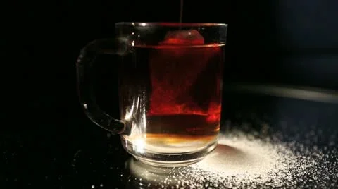 Hand and tea pack Stock Footage 21880124